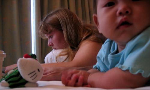 Girls busy on the bed